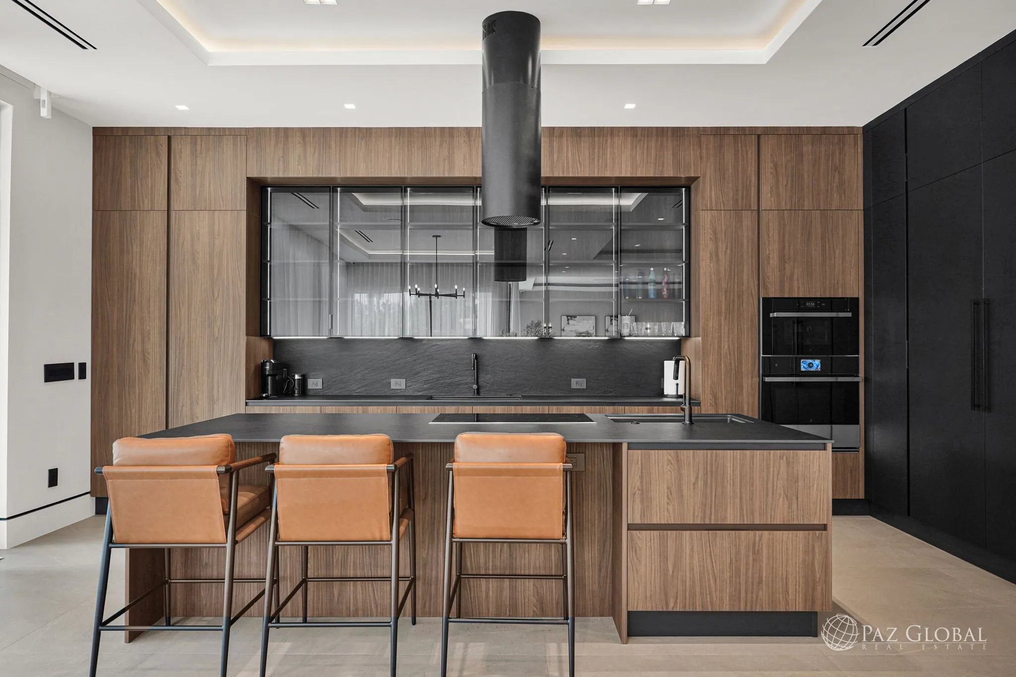 Italian kitchen with island, bar seating and black range hood