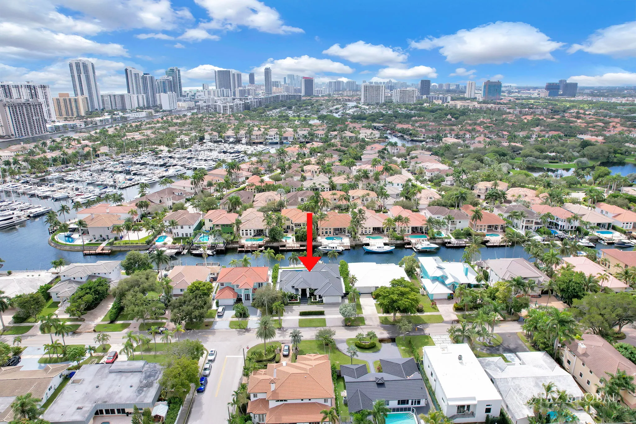 Aerial view of Hollywood Golf Estates with the home marked, the Intracoastal and Hollywood Beach beyond